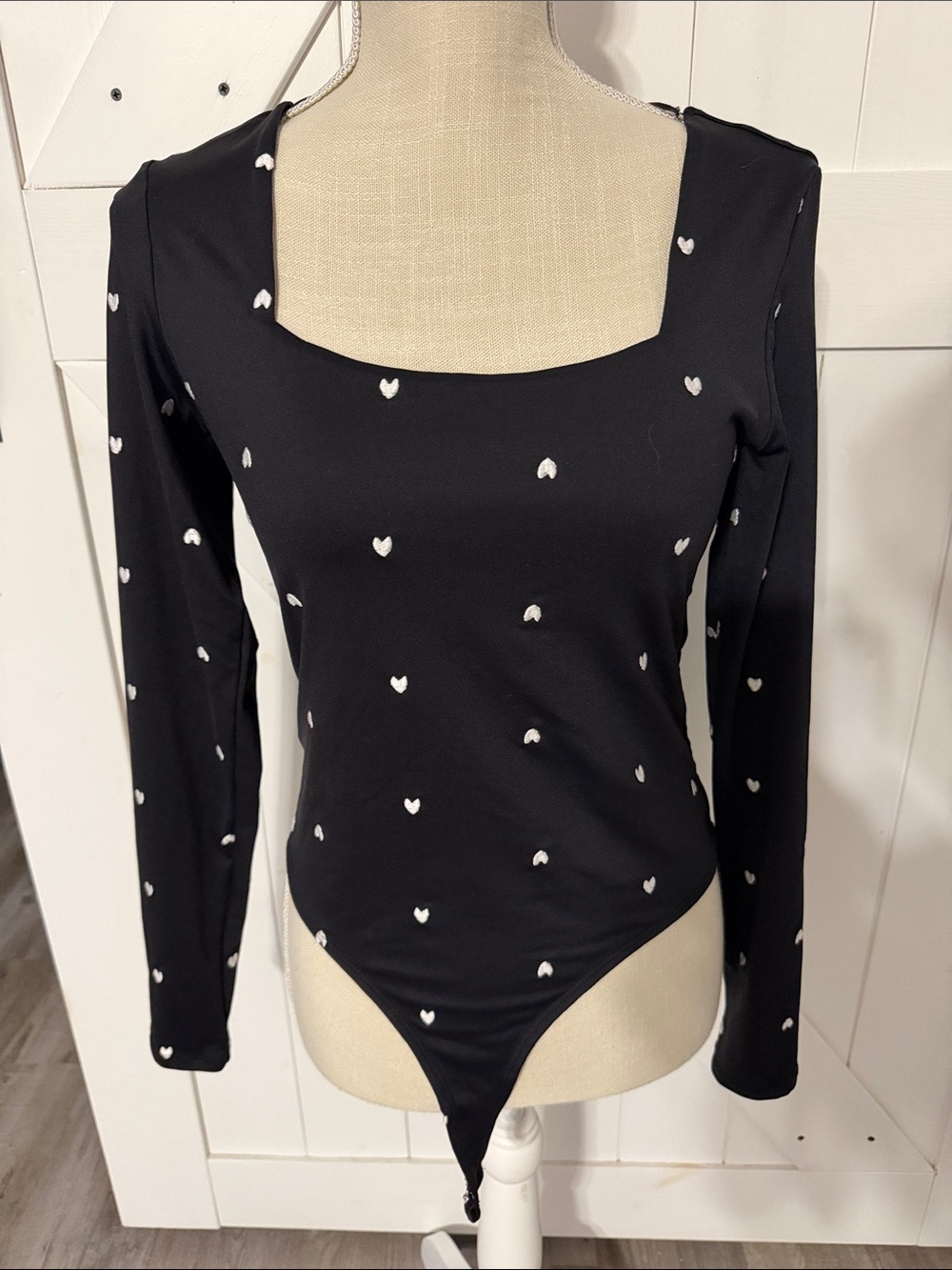 Women’s Francesca’s black heart body suit